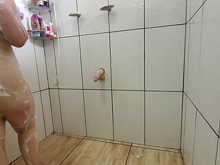 Very naughty stepmom takes a shower with the door open and rolls naked with her thick cock!